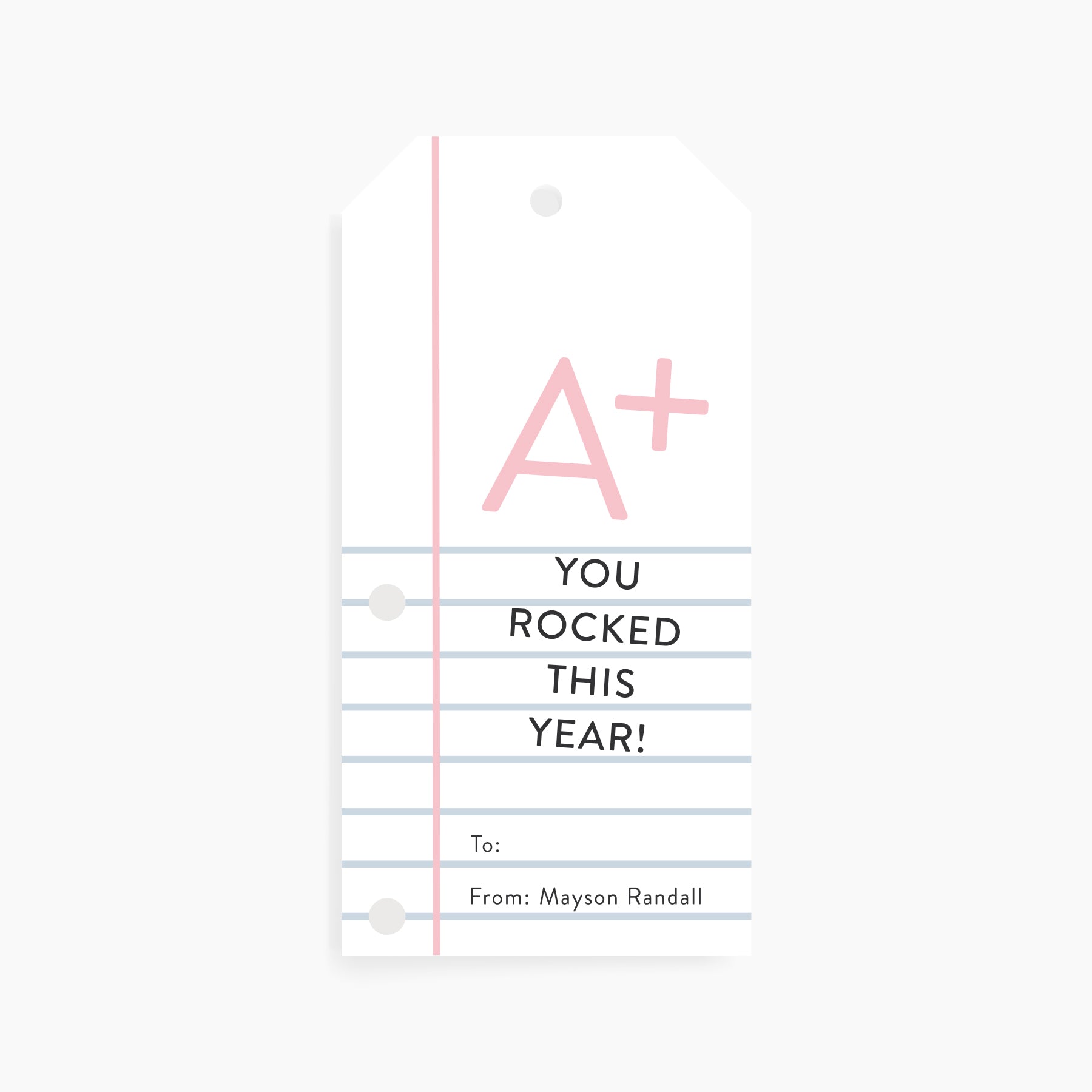Personalized teacher gift tag designed like notebook paper with pink “A+” and text that reads You Rocked This Year.