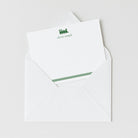 Train personalized note card in green with custom name, shown inside white envelope.