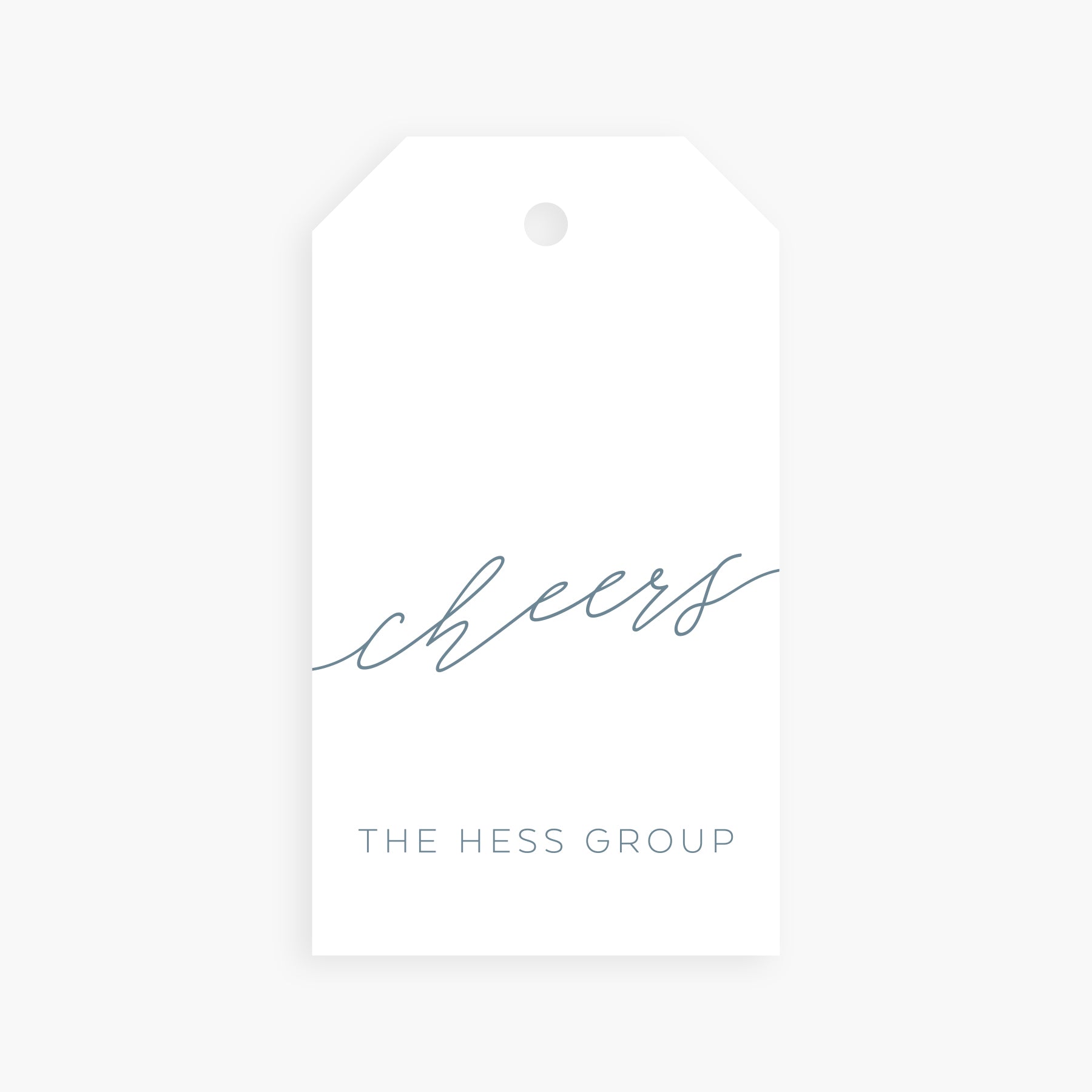 Personalized gift tag with the word cheers in dusty blue script and custom family or group name below.