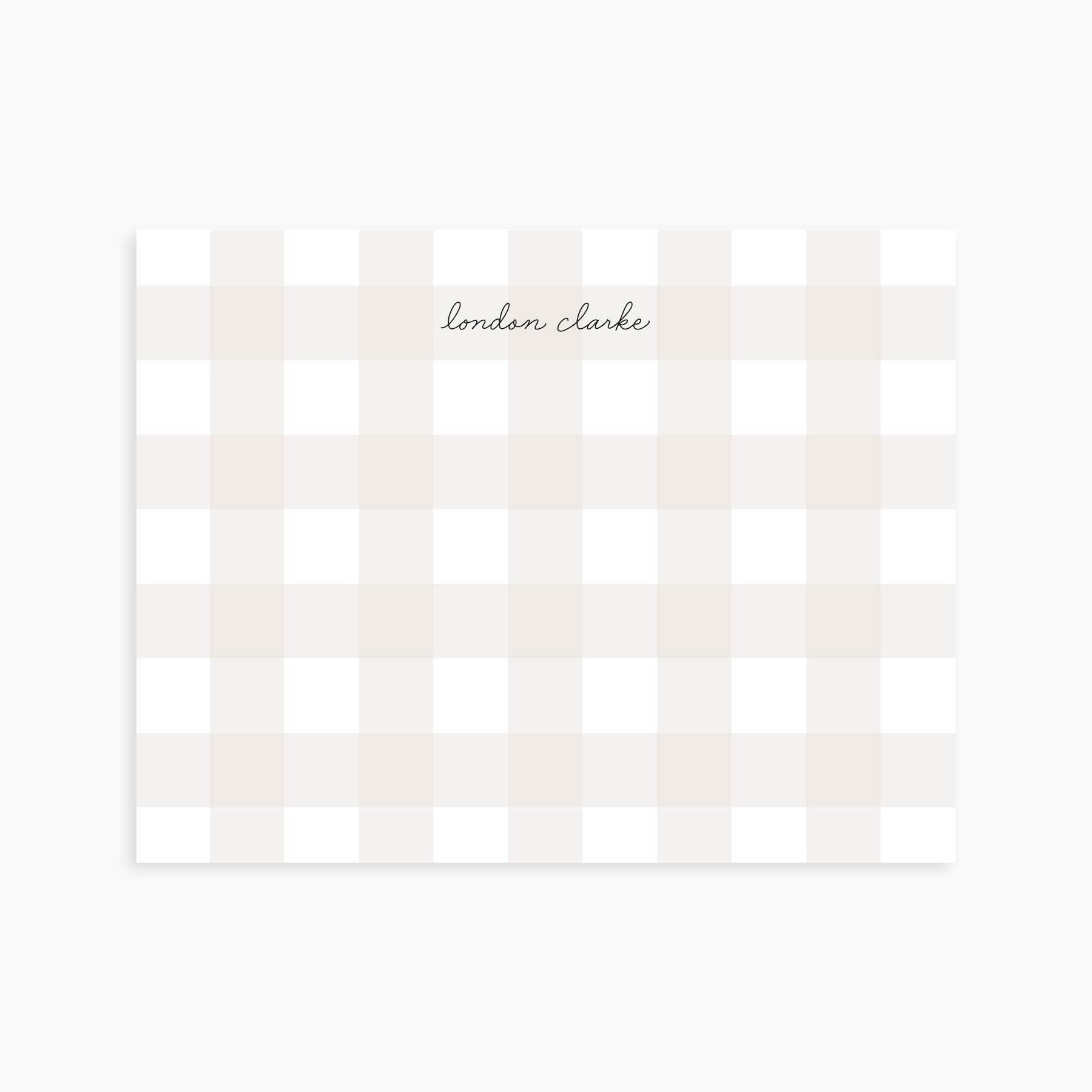 Personalized note card with neutral gingham pattern and elegant script name in black ink.